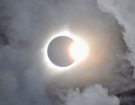 Photo of eclipse with clouds around it in 2017